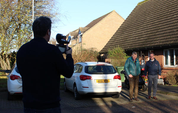 Presenter Tom Heap and Project Lead Richard Egle Being Filmed Outside House