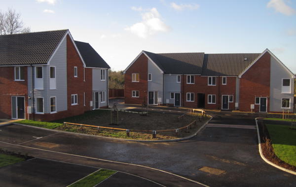 Group Of Houses In A Corner Of An Estate With Front Gardens