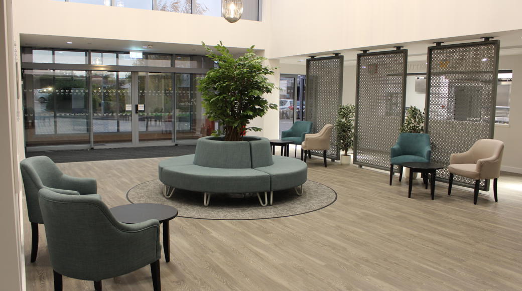 Entrance Area With Chairs, Tables And Indoor Tree