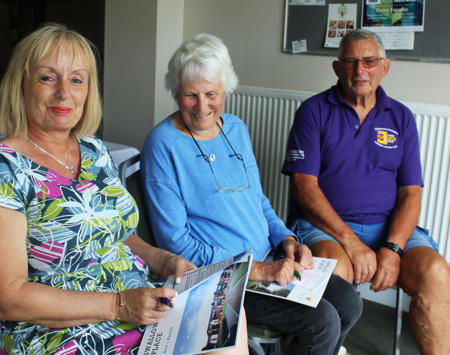 Saffron Staff Member And Two Tenants Sitting Together 