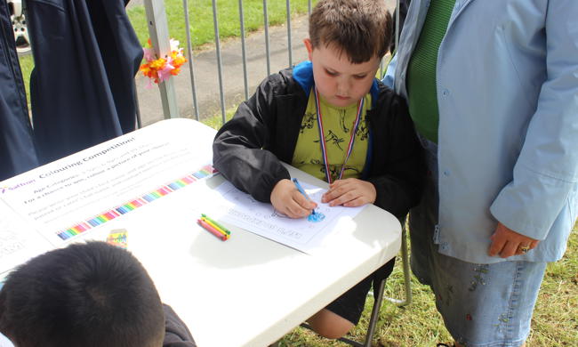 Young Boy Colouring At Table