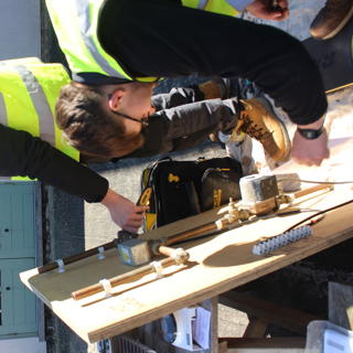 Apprentices Working On A Heating Task